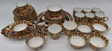 Thirty four pieces of Royal Crown Derby tea and coffee ware, including 23cm plate in 1128 pattern, 6