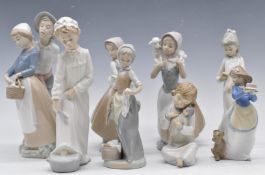 Collection of Nao figurines, tallest 28cm