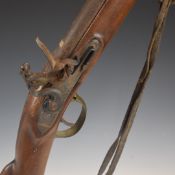 Flintlock carbine rifle with line engraved lock and hammer, brass trigger guard and butt plate,
