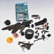 A collection of gun parts and accessories including Beamshot Airgun Laser Sight, snapcaps,