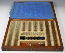 Mahogany cased set of opticians lenses with test frames to suit, width of case 44cm