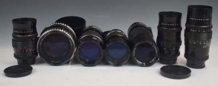Seven SLR or similar camera lenses with M42 Praktica mounts, comprising two Pentacon 2.8/135,