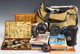 Trout fishing equipment, books and accessories to include reels, fly boxes and contents, accessories