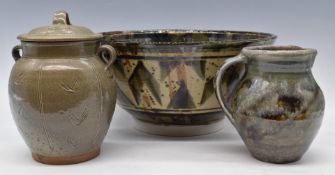 Large studio pottery pedestal bowl initialled CW, covered jar and a jug, largest diameter 33.5cm,