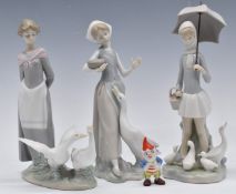 Three Lladro figures and a Wade Big Ears, tallest 27cm