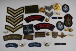 Small collection of badges and rank insignia including a Royal Air Force gilt example, Royal Navy