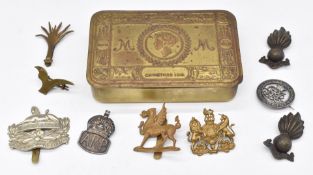 WW1 Princess Mary Christmas tin, together with metal badges for the Royal Artillery, Gloucestershire