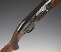 Baikal 12 bore five-shot semi-automatic shotgun with engraved lock, chequered semi-pistol grip and