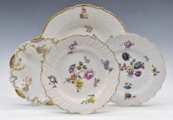 Pair of Meissen plates decorated with flora and fauna, similar large charger (mark