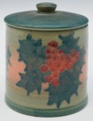 Dennis Chinaworks signed circular covered box decorated with holly, script to base 'Trial 40' and