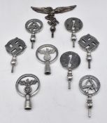 Nine reproduction German Nazi Third Reich flag pole tops including two SS examples