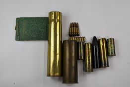 Five brass shell cases, inert rubber bullet baton round, inert ammunition and a WW2 possible ATS