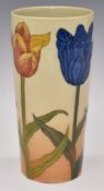 Dennis Chinaworks signed limited edition 61/74 cylinder vase decorated with tulips on copper, H19cm