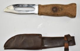 Lightweight cork handle fishing knife with 12cm cut out double edged blade, one edge serrated, by