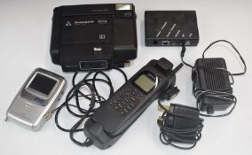 Retor Nokia RAE-1N A mobile phone, Casio TV-970 travel televison and a Kodamatic 970L Polaroid