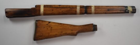 Short magazine Lee Enfield bolt-action rifle stock with storage compartment to the brass butt