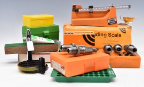 A collection of reloading tools and accessories including Lyman Powder Dribbler, D-7 Reloading