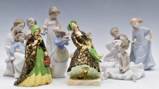 Nine boxed Nao figures and two Tuscan China figurines, April Showers and Lady of the Lamp, both '