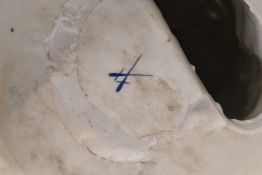 Large continental porcelain figurine with flower basket and blue crossed sword mark to base,