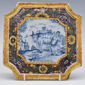 Delft 18th/19thC Dutch shaped plaque with pastoral scene and polychrome decorated surround, 22.5 x