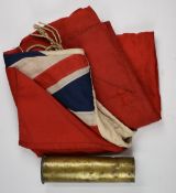 British Ensign flag, 260 x 120cm, and a brass shell case, H28cm