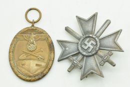 Two WW2 German Nazi Third Reich medals, comprising War Merit Cross and Western Wall, acquired during