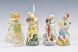 Seven Royal Worcester figures from the Days of the Week series and a 'First Dance' figurine, tallest