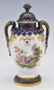Royal Worcester twin handled covered pedestal vase decorated with Birds of Paradise, signed E Salter