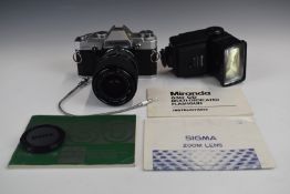 Olympus OM30 35mm SLR camera with Sigma 28-0mm 1:3.5-4.5 lens and Miranda flashgun