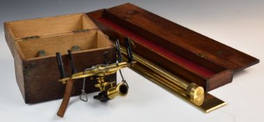 Cased brass surveyor's compass and sighting instrument and large brass rolling rule in mahogany