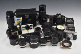 Canon T90 35mm SLR camera with 200mm 1:4 lens, carrying case and manual, together with a further