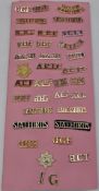 Card display of approximately thirty Staybrite shoulder titles, mostly in pairs including Staffords,