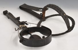 Two vintage large steel and wrought iron animal traps with circular ends, largest 53 x 25 x 18cm