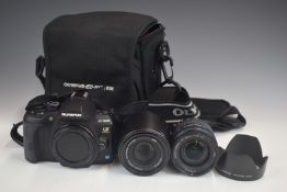 Olympus E-620 digital camera together with Zukio Digital 14-42mm 1:3.5-5.6 and 40-150mm 1:4-5.6