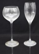 A set of ten WMF wine glasses with WMF stickers, together with a set of twelve champagne flutes,