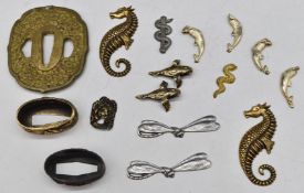 Small collection of tsuba fittings including ducks, seahorses etc. PLEASE NOTE ALL BLADED ITEMS