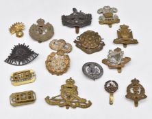 Collection of British Army metal badges including 8th King's Royal Irish Hussars, The Welsh