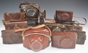 Vintage leather camera cases to include Leica, FED and Ensign