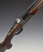 Midland 12 bore over and under shotgun with engraved lock, underside, trigger guard, top plate and