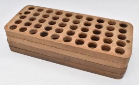 A set of four stacking hardwood 12 bore shotgun cartridge reloading trays each fitting 50
