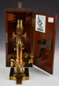 Ross London late Victorian or early 20thC brass microscope, with screw x and y adjustment for the