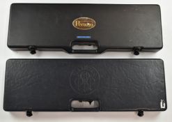 Two shotgun cases, one Beretta and one marked Perazzi, both with fitted interiors, each 79x25x8cm.
