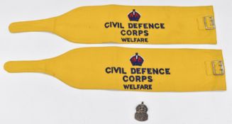 Two Civil Defence arm bands with ink stamp 1954 Lewis Falk Ltd, broad arrow and CD/48 to interior,