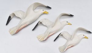 Three Beswick retro/kitsch flying seagull wall plaques 658/2, 658/3, 658/4, longest 29cm