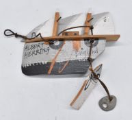 John Maltby (1936-2020) a carved wooden sailing ship wall plaque 'Albert Herring, England' with fish