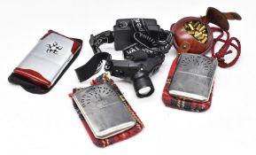 Three various hand warmers including two Peacock, together with a Super LED head torch, a leather