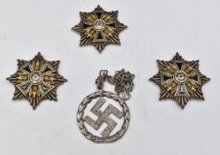 Three reproduction German Nazi Third Reich D.A.P medals/badges together with a wreathed swastika