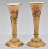 Royal Worcester blush ivory pair of flared pedestal vases decorated with flowers, H14cm