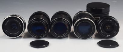 Five Carl Zeiss Jena SLR camera lenses with screw mounts, comprising MC 1:3.5 f=135 and similar