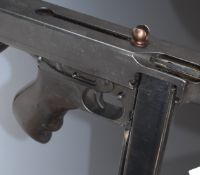 Deactivated American 1928A1 Thompson submachine gun with extended magazine wooden stock, pistol grip